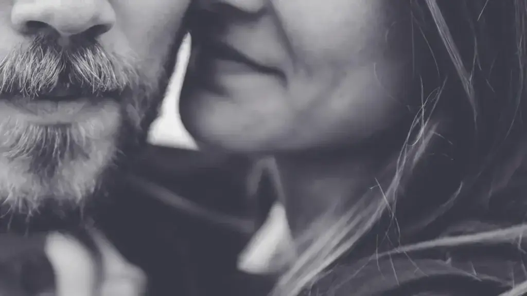 closeup of a woman about to kiss a man's cheek sex and marriage